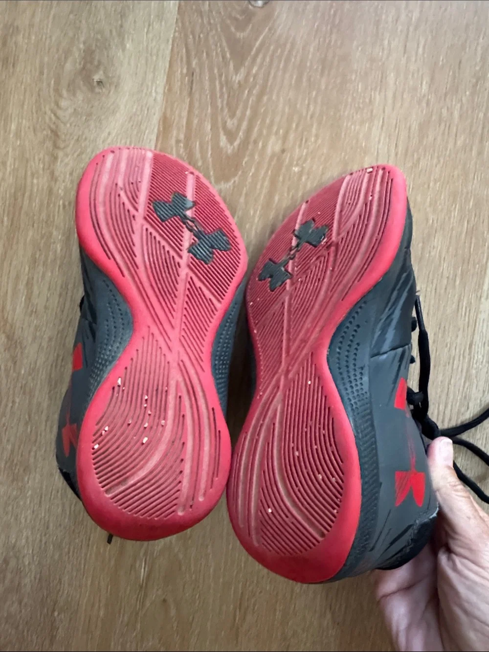 Under Armour red and black boys basketball shoes. Size 1Y.